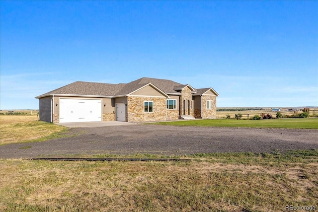 45425 Wolf Creek Dr, Bennett, CO 80102 - view of front facade featuring dirt driveway, an attached garage, and a front yard