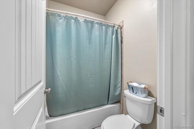 45425 Wolf Creek Dr, Bennett, CO 80102 - bathroom featuring toilet and shower / bathtub combination with curtain