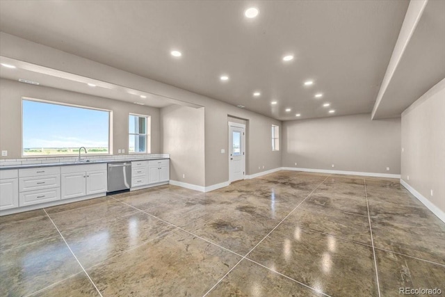 45425 Wolf Creek Dr, Bennett, CO 80102 - unfurnished living room with baseboards and recessed lighting