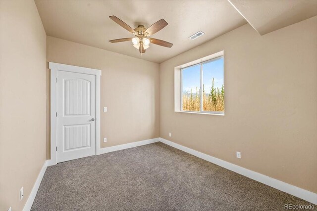 45425 Wolf Creek Dr, Bennett, CO 80102 - empty room with ceiling fan and carpet flooring