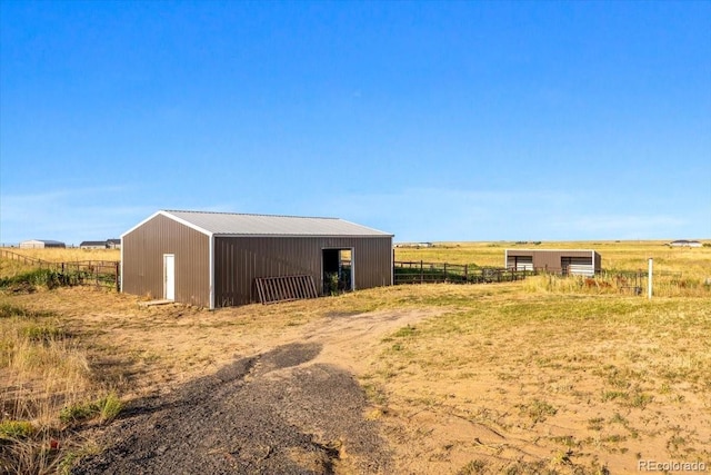 45425 Wolf Creek Dr, Bennett, CO 80102 - view of pole building with a view of countryside