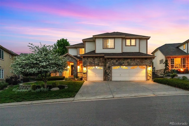 6427 S Tibet St, Aurora, CO 80016 - traditional-style house with stone siding, an attached garage, and concrete driveway
