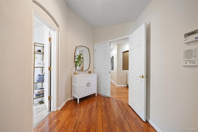 6427 S Tibet St, Aurora, CO 80016 - corridor featuring wood finished floors and baseboards