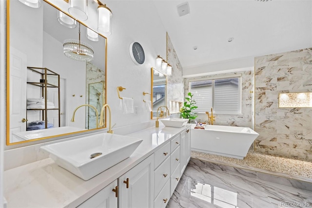 6427 S Tibet St, Aurora, CO 80016 - full bath with a freestanding bath, double vanity, a marble finish shower, a chandelier, and marble finish floors