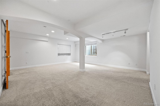 6427 S Tibet St, Aurora, CO 80016 - basement with recessed lighting, light colored carpet, and arched walkways