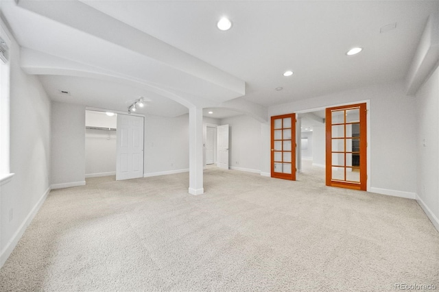 6427 S Tibet St, Aurora, CO 80016 - finished below grade area with carpet, recessed lighting, and arched walkways