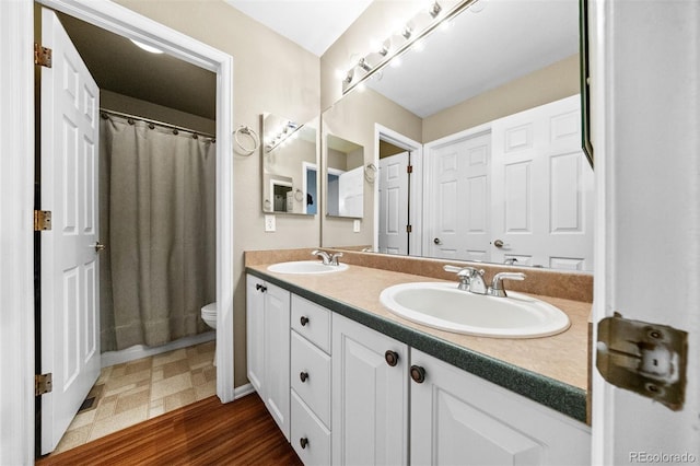 6427 S Tibet St, Aurora, CO 80016 - bathroom featuring double vanity and a shower with curtain