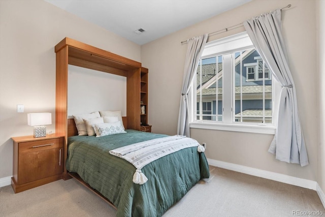 bedroom with carpet, baseboards, and visible vents