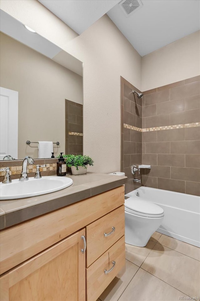 full bath featuring toilet, visible vents, tile patterned flooring, vanity, and tub / shower combination