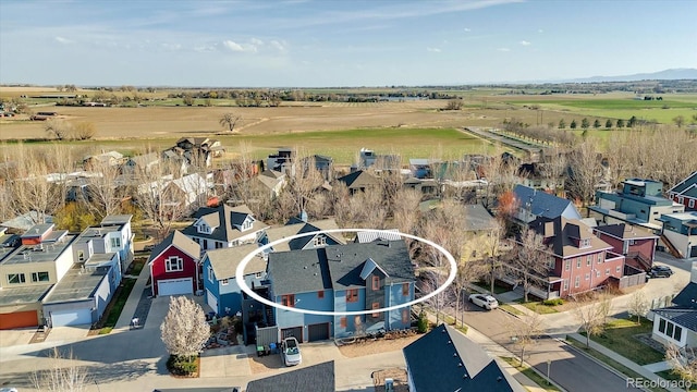 drone / aerial view with a rural view and a residential view