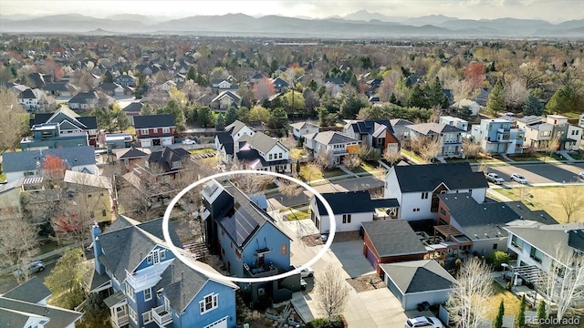 birds eye view of property with a mountain view and a residential view