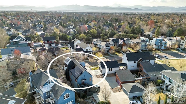 drone / aerial view with a mountain view and a residential view