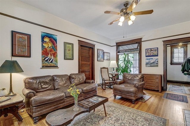 living room featuring wood finished floors and ceiling fan