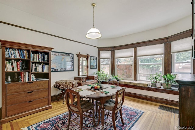 dining area with light wood-style flooring