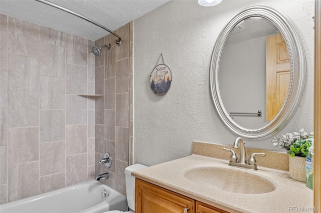 4400 Lodgepole Cir Unit 101, Silverthorne, CO 80498 - bathroom with  shower combination, vanity, a textured wall, toilet, and a textured ceiling