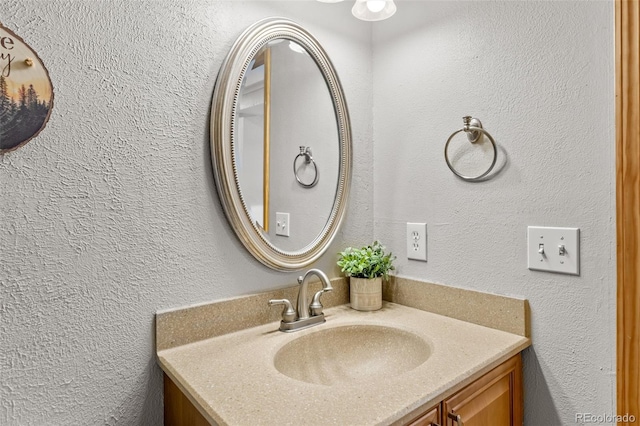4400 Lodgepole Cir Unit 101, Silverthorne, CO 80498 - bathroom with vanity and a textured wall