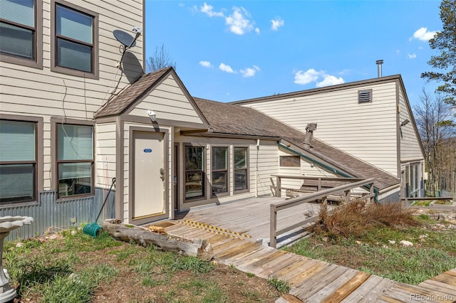 4400 Lodgepole Cir Unit 101, Silverthorne, CO 80498 - doorway to property with a wooden deck and roof with shingles