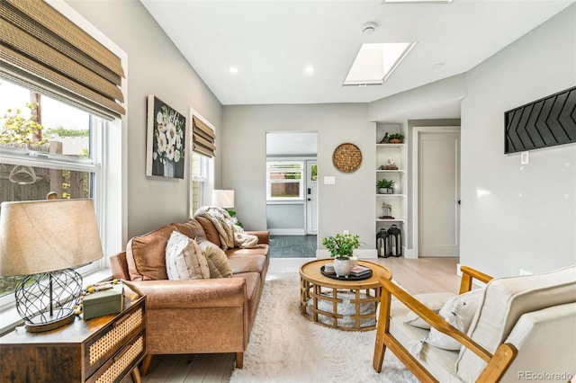 3625 W 9th Ave, Denver, CO 80204 - living area with a skylight, light wood-style floors, recessed lighting, and baseboards