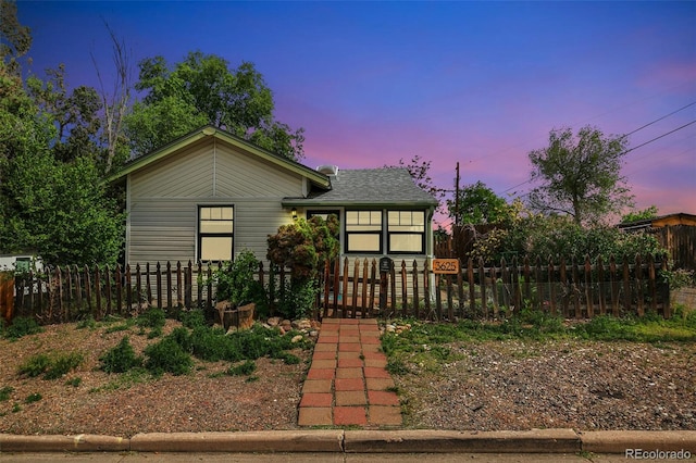 3625 W 9th Ave, Denver, CO 80204 - bungalow-style house with a fenced front yard and roof with shingles