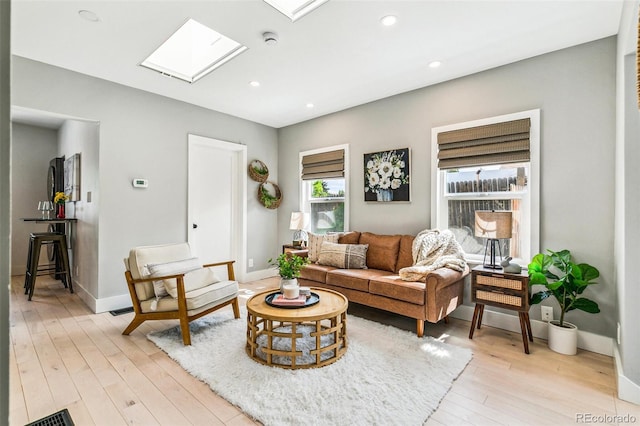 3625 W 9th Ave, Denver, CO 80204 - living area with a skylight, light wood finished floors, recessed lighting, and baseboards