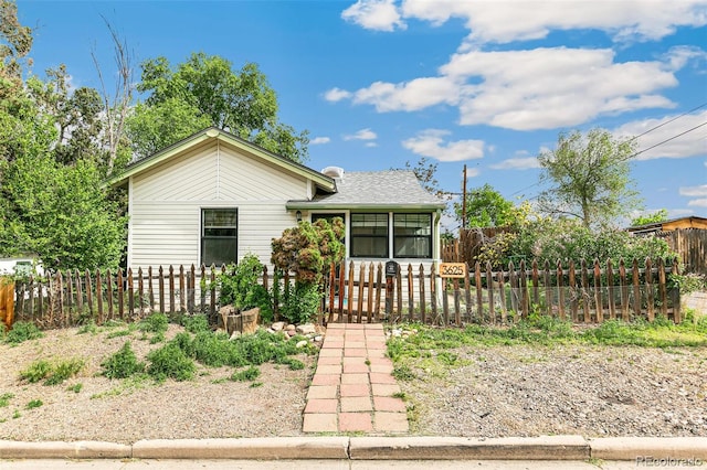 3625 W 9th Ave, Denver, CO 80204 - bungalow-style house with a fenced front yard and a gate