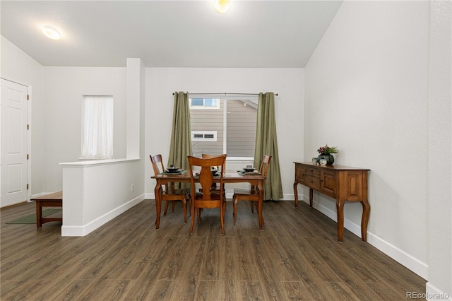 dining area with dark wood-type flooring