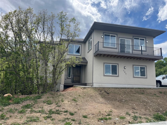 485 Cardiff Cir, Colorado Springs, CO 80906 - rear view of property featuring a balcony and stucco siding