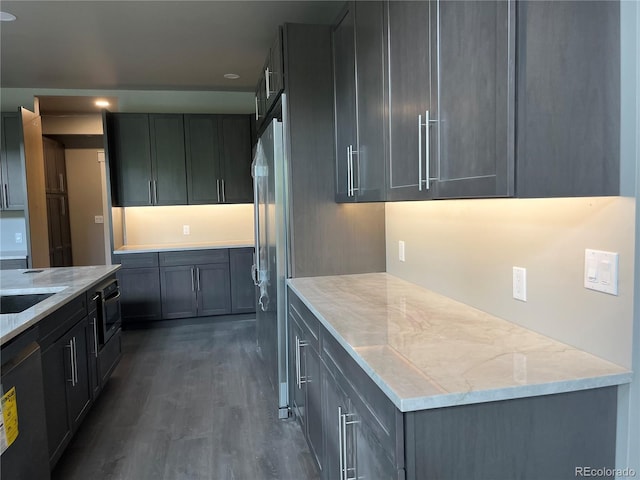 485 Cardiff Cir, Colorado Springs, CO 80906 - kitchen with dark wood-style flooring, stainless steel appliances, and light stone counters