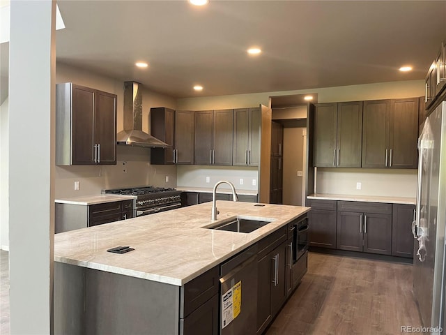 485 Cardiff Cir, Colorado Springs, CO 80906 - kitchen with wall chimney exhaust hood, a sink, premium appliances, dark wood-type flooring, and recessed lighting