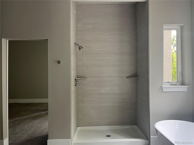 485 Cardiff Cir, Colorado Springs, CO 80906 - full bathroom featuring a freestanding bath and a tile shower