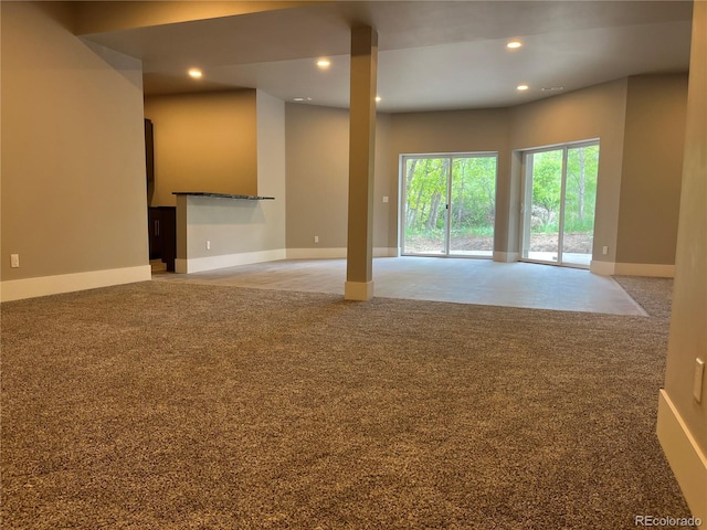 485 Cardiff Cir, Colorado Springs, CO 80906 - unfurnished living room featuring recessed lighting, baseboards, and carpet