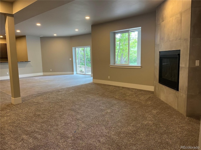 485 Cardiff Cir, Colorado Springs, CO 80906 - unfurnished living room with carpet flooring, a fireplace, recessed lighting, and baseboards