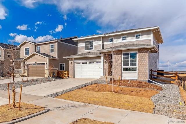 view of front of property featuring a garage, fence, concrete driveway, and brick siding