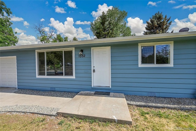 1552 W Caley Ave, Littleton, CO 80120 - property entrance featuring an attached garage