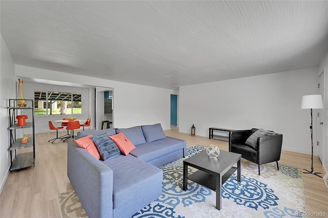 1552 W Caley Ave, Littleton, CO 80120 - living area featuring light wood finished floors and baseboards