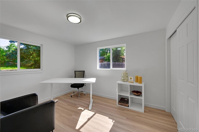 1552 W Caley Ave, Littleton, CO 80120 - home office featuring light wood-type flooring and baseboards