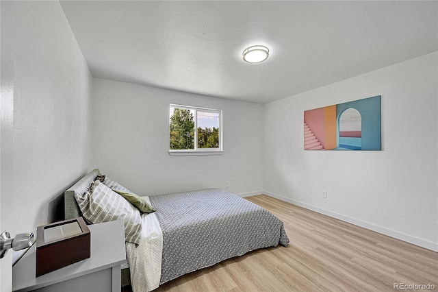 1552 W Caley Ave, Littleton, CO 80120 - bedroom featuring wood finished floors and baseboards
