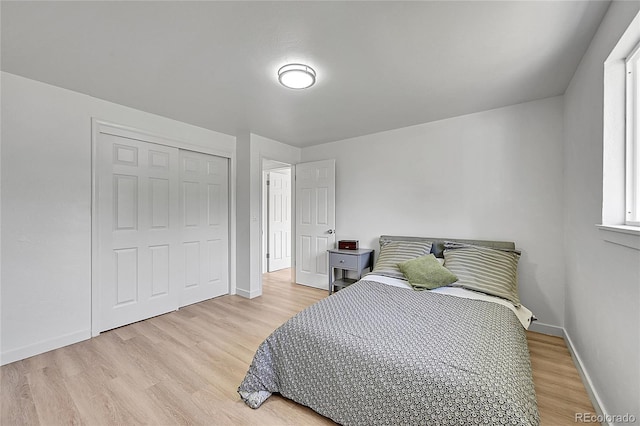 1552 W Caley Ave, Littleton, CO 80120 - bedroom with light wood-style floors and a closet