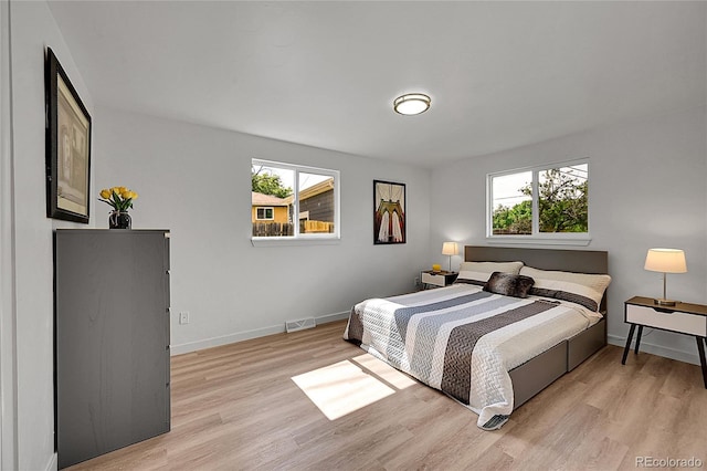 1552 W Caley Ave, Littleton, CO 80120 - bedroom with light wood-style flooring and baseboards