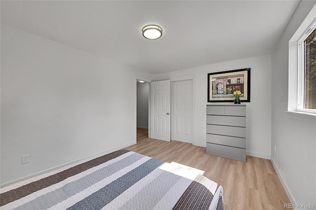1552 W Caley Ave, Littleton, CO 80120 - unfurnished bedroom with light wood finished floors and a closet