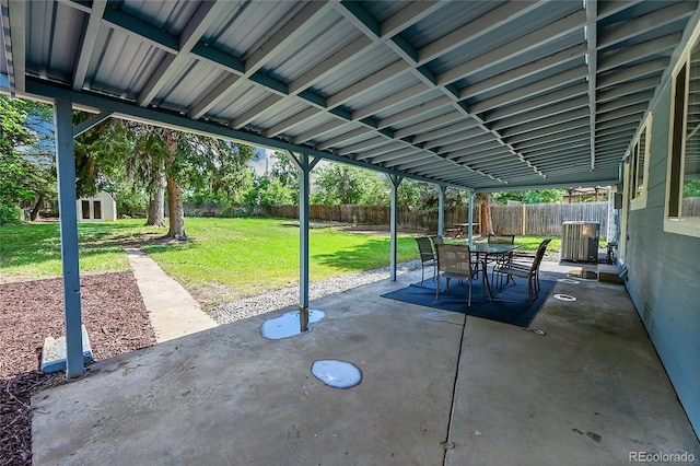 1552 W Caley Ave, Littleton, CO 80120 - fenced backyard with a patio, outdoor dining space, and an outdoor structure