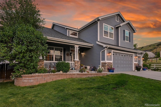 4069 Copper Ct, Castle Rock, CO 80104 - view of front of property featuring a porch, an attached garage, stone siding, concrete driveway, and a shingled roof