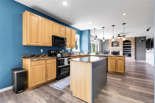 4069 Copper Ct, Castle Rock, CO 80104 - kitchen featuring black appliances, light brown cabinetry, a peninsula, dark wood finished floors, and recessed lighting