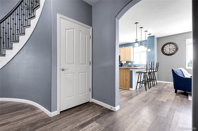 4069 Copper Ct, Castle Rock, CO 80104 - entryway with arched walkways and wood finished floors