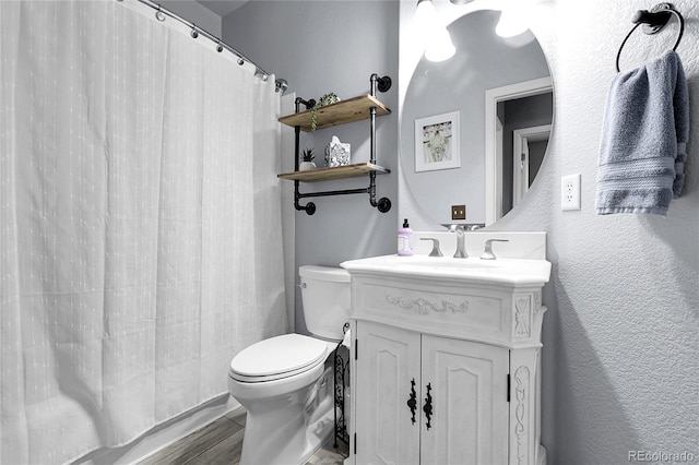 4069 Copper Ct, Castle Rock, CO 80104 - full bathroom featuring vanity, wood finished floors, a shower with shower curtain, and a textured wall