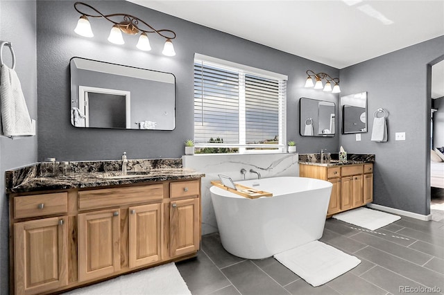 4069 Copper Ct, Castle Rock, CO 80104 - bathroom with two vanities, a soaking tub, and tile patterned flooring