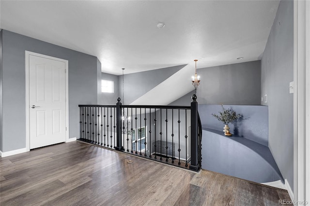4069 Copper Ct, Castle Rock, CO 80104 - hallway with wood finished floors and a chandelier