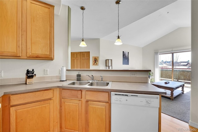 kitchen with a sink, decorative light fixtures, a peninsula, white dishwasher, and lofted ceiling