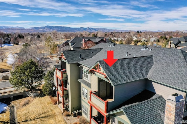 drone / aerial view with a mountain view and a residential view