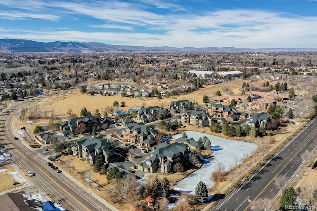 birds eye view of property featuring a mountain view and a residential view